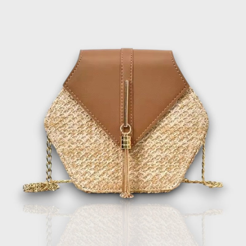 Side view of Celeste Hexagon crossbody with sculpted shape and chic chain strap