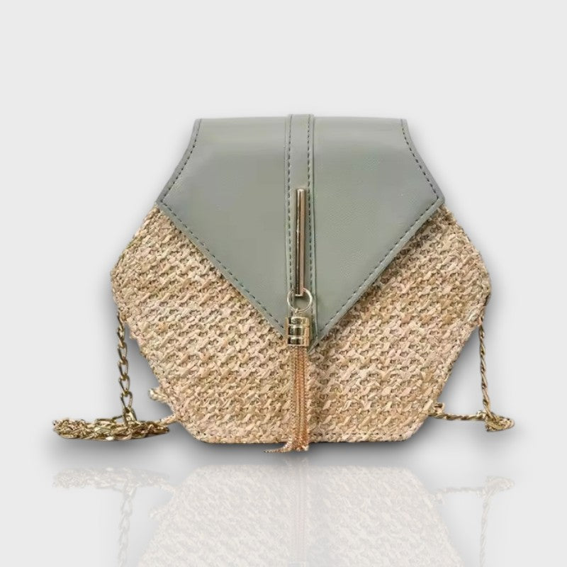 Side view of Celeste Hexagon crossbody with sculpted shape and chic chain strap