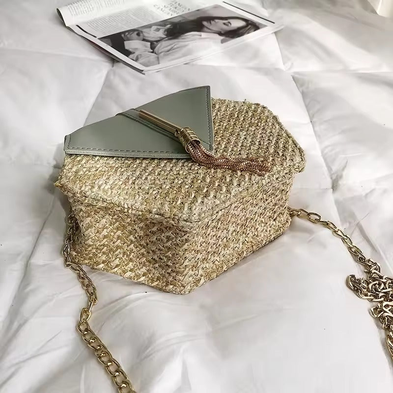 Side view of Celeste Hexagon crossbody with sculpted shape and chic chain strap